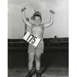 Shopsy hot dog contest, Canadian National Exhibition, Toronto, 7 August 1961. Ontario Jewish Archives, Blankenstein Family Heritage Centre, item 5012.|The photoraph is shows a young boy wearing a Shopsy's hat with a hot dog in each hand.